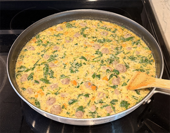 Reduce the heat to medium-low. Slowly stir in the fat-free half & half and let the soup heat gently for about 1 minute. It should be hot but not boiling.
