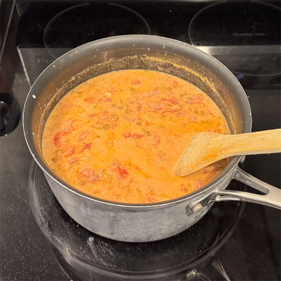 Bring to a boil over medium-high heat. Partly cover the pot with a lid, reduce the heat to medium-low, and cook for about 15 minutes, stirring occasionally.