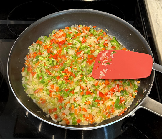 Stir in the bell peppers with the onions and continue cooking for another 2 minutes.